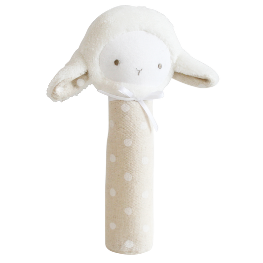 Lamb hand squeaker toy sitting upright on neutral background, soft cotton texture visible.