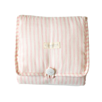 Foldable pink striped quilted change mat displayed flat on a white background.