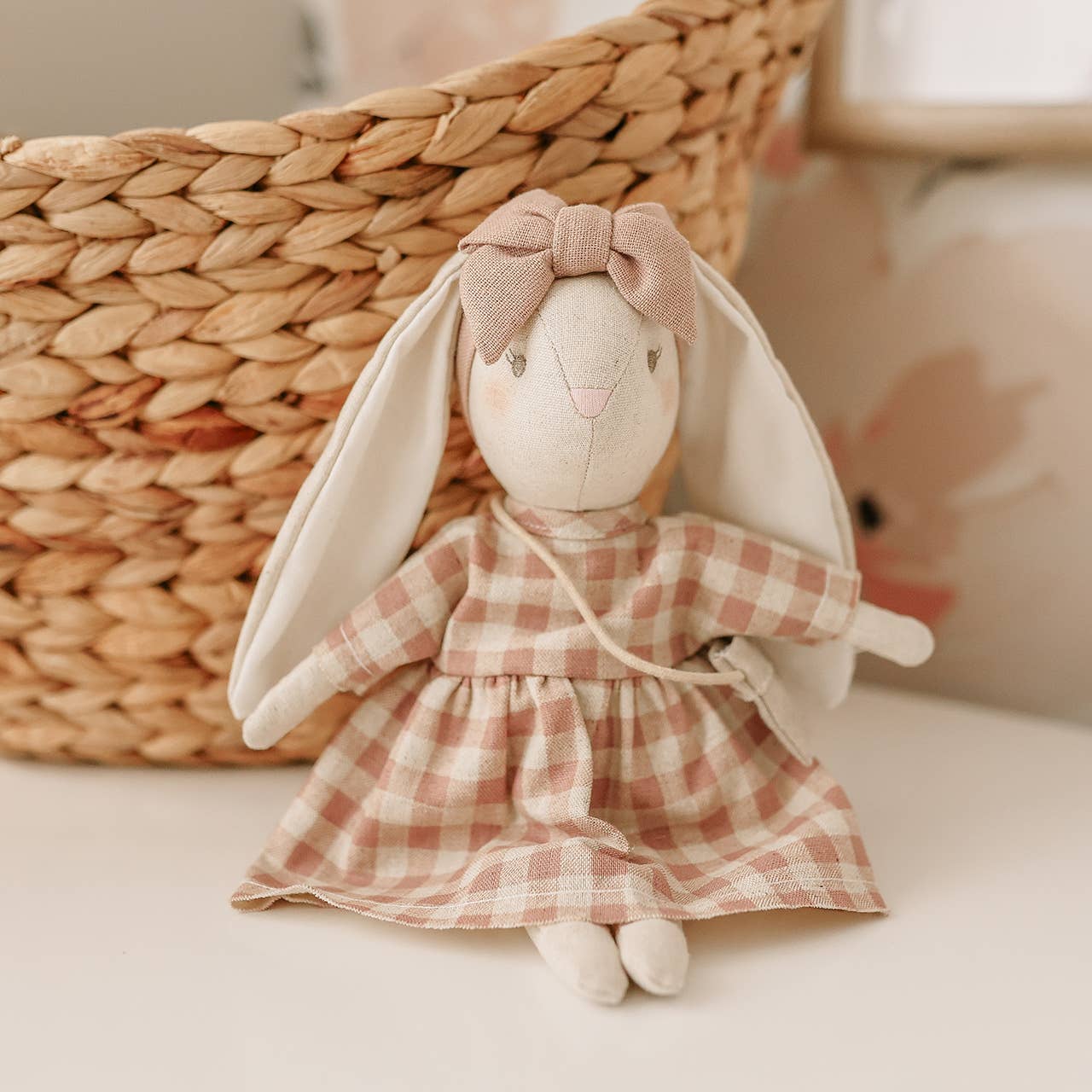 Mini Sofia Bunny plush toy displayed styled with neutral nursery accessories.