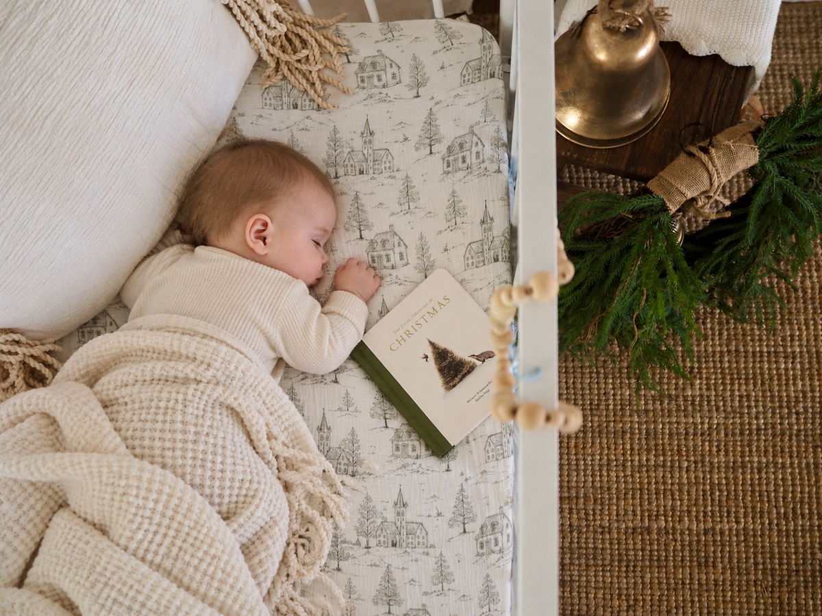Organic muslin Christmas cot sheet featuring a nostalgic European-inspired Christmas toile print, designed for Australian standard cots by Ever After Baby Co.